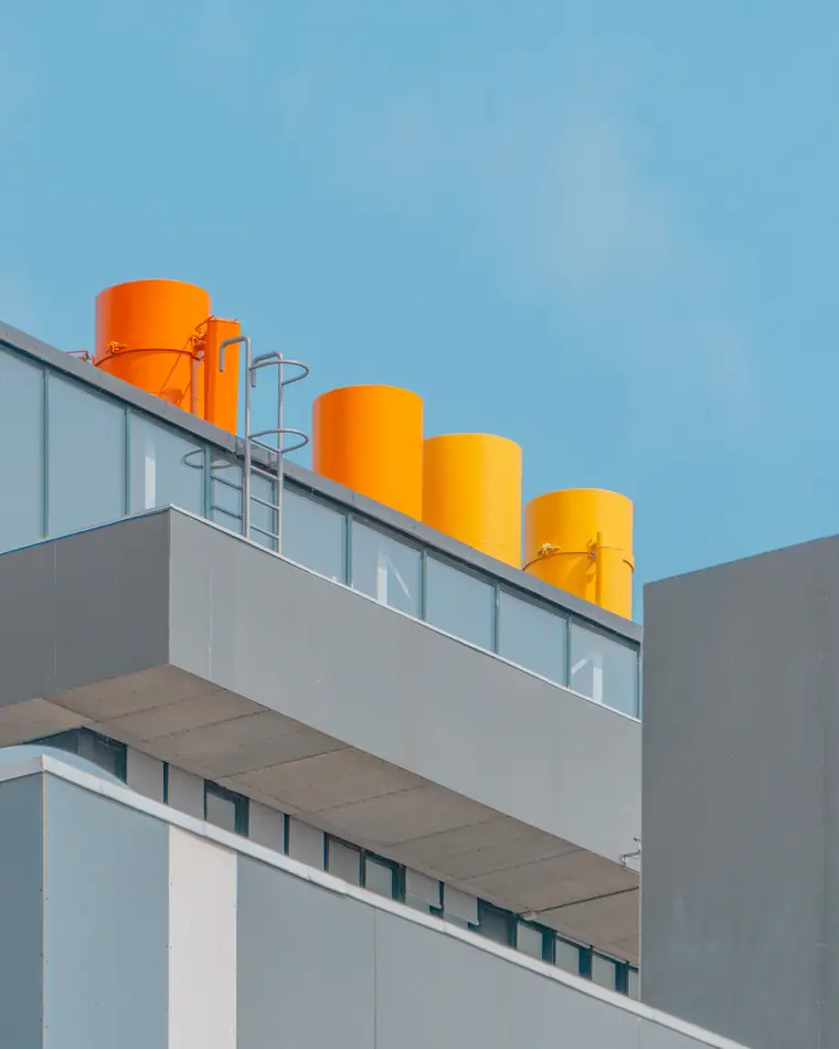 Industrial building with orange chimneys